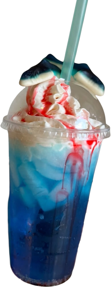 Blue soda topped with whipped cream, red syrup and gummy candies